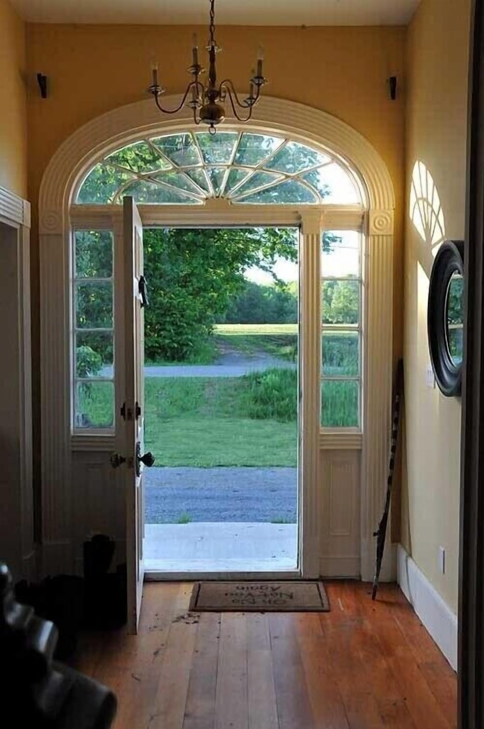The front door looks over a farmer's field.
