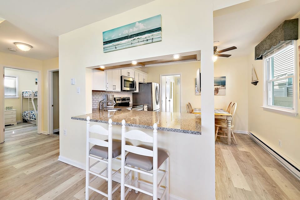 To left is front 2 BRs, full bath & W/D. Through kitchen is the back bedroom.