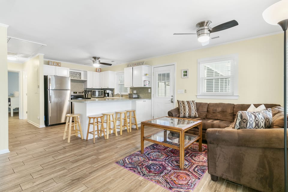 The kitchen overlooks the living room, perfect to entertaining during your stay.
