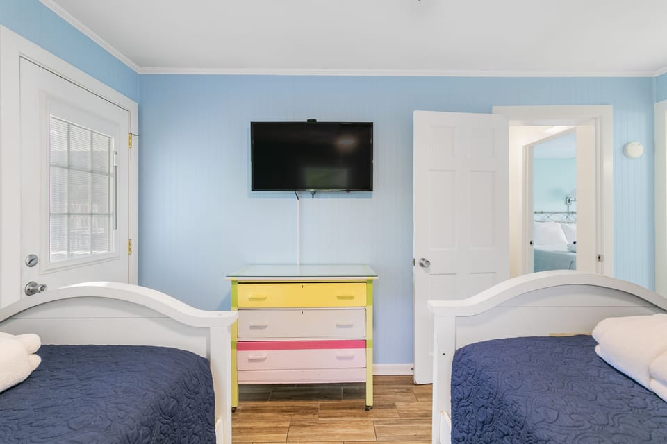 Upstairs guest room with two twin beds.