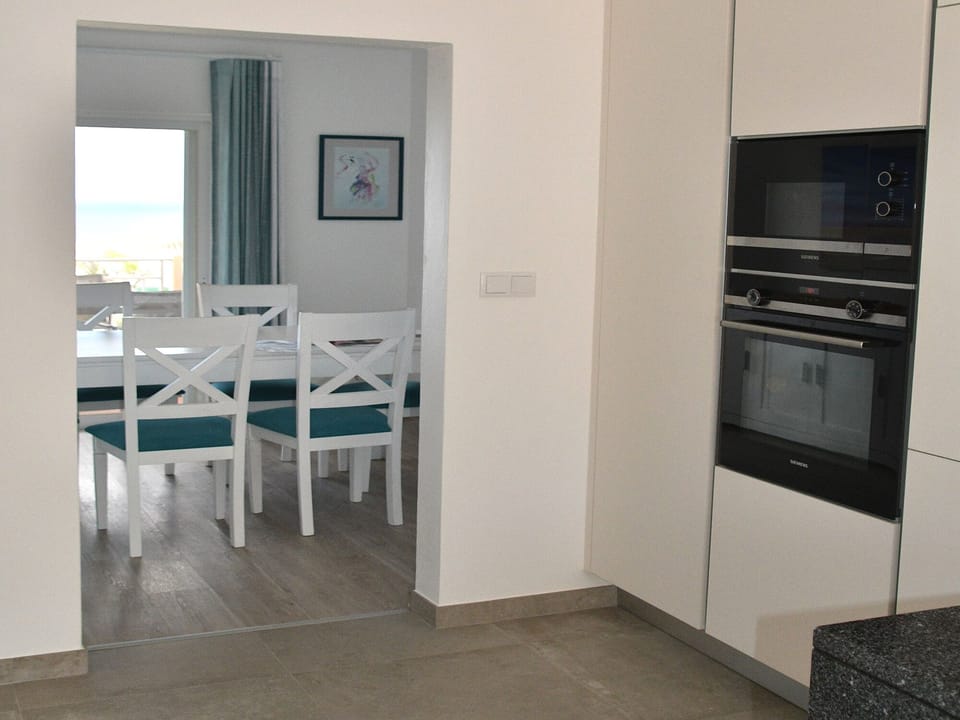 Kitchen with direct access to the dining area and living rom