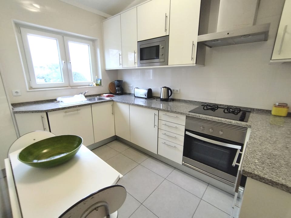 Bright well-equipped kitchen near the living room and guest toilet