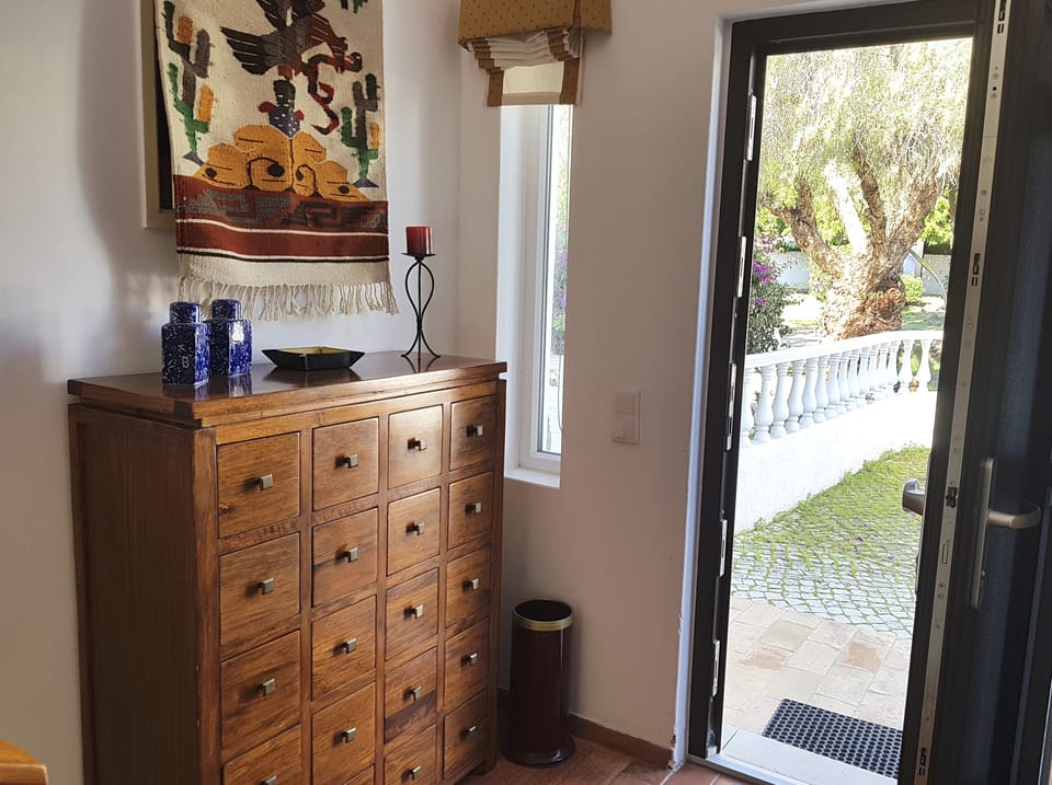 Front hall has stairs to upstairs living area and a few steps down to bedrooms