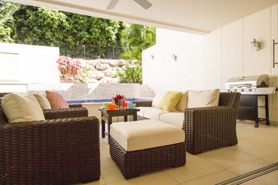 Outdoor furniture; pool area; manicured garden
