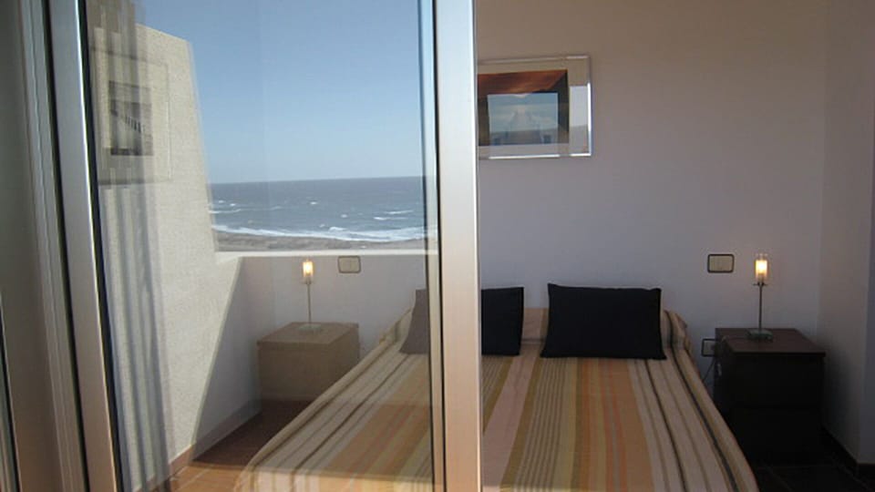 The double bedroom with sliding doors to terrace and amazing ocean views