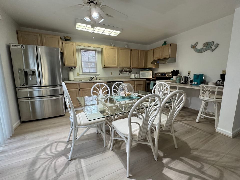 Open dining space ideal for family meals and game nights in your Bethany Beach .