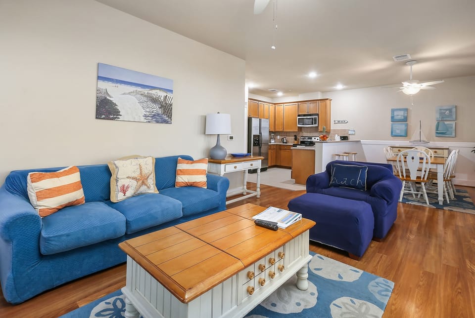 Spacious open floor plan with ocean views from living, dining, & kitchen.
