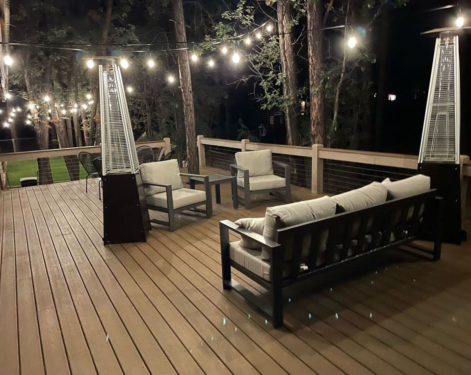 Relax in the fresh night air on the backyard deck.