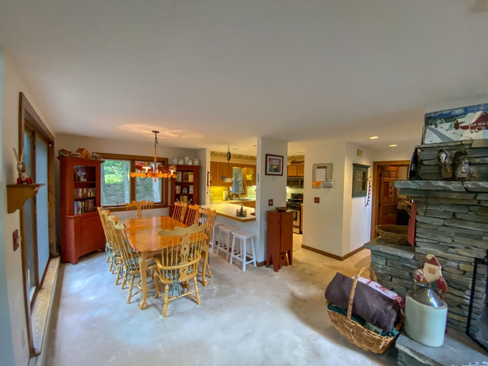 Large dining room table with open view to the deck