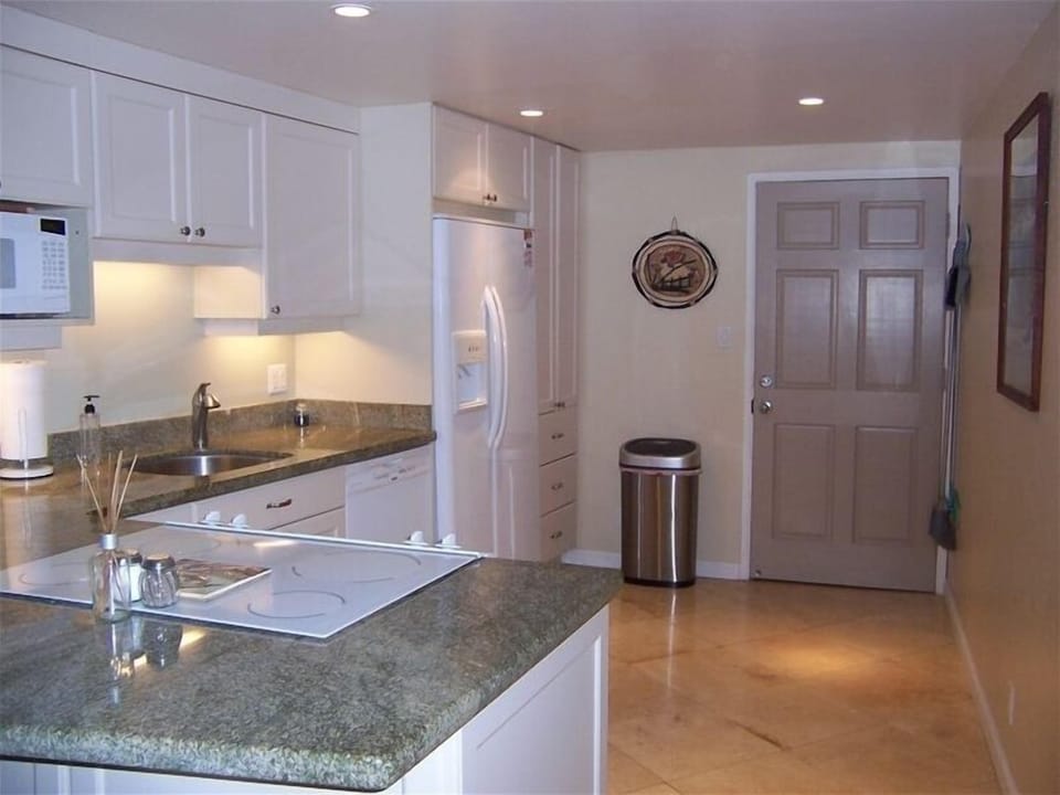 Kitchen with all Appliances, Granite  Countertops and Stone Floor
