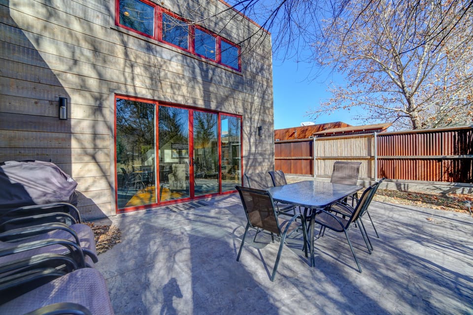 Private patio with propane BBQ. Cottonwood trees along the back fence.