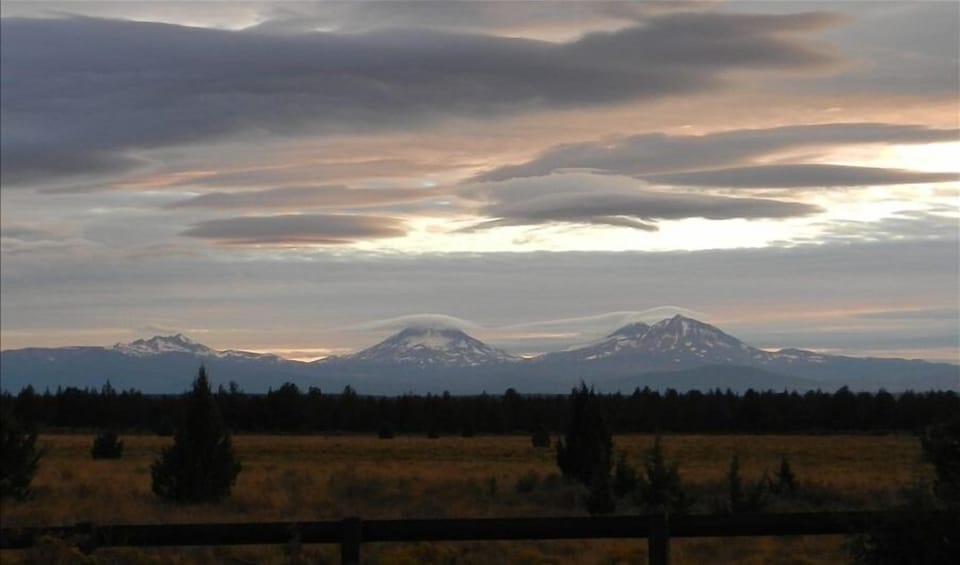 The Three Sisters and Broken Top across the meadow