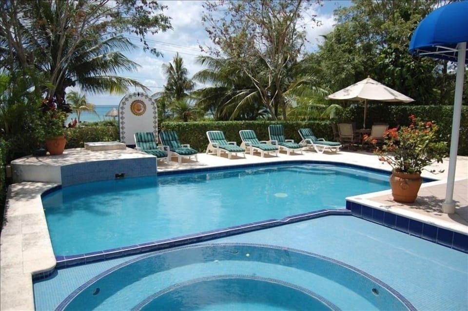 You can see the ocean beyond the private fresh wter pool.