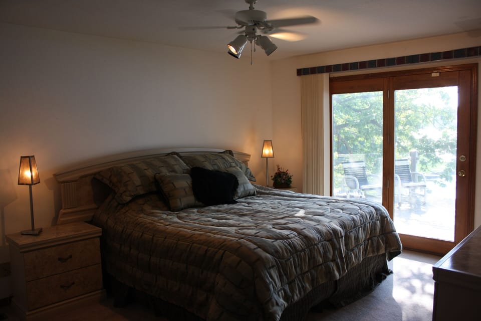 king size master bed, with deck access