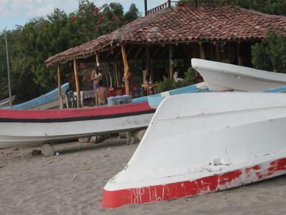 Enjoy beachside dining at one of several restaurants in nearby village Gigante