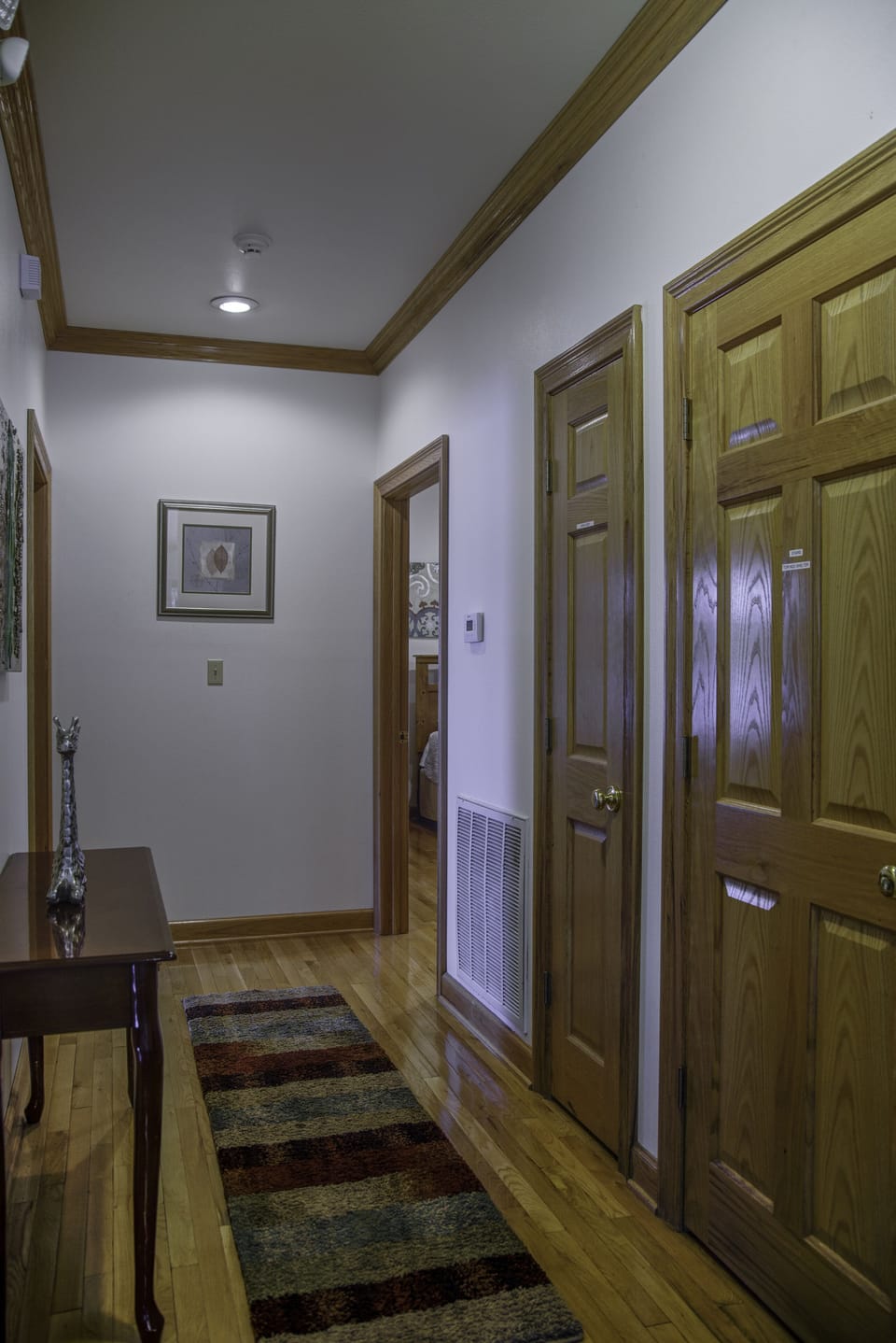 The hallway that leads to the 2 master bedrooms.