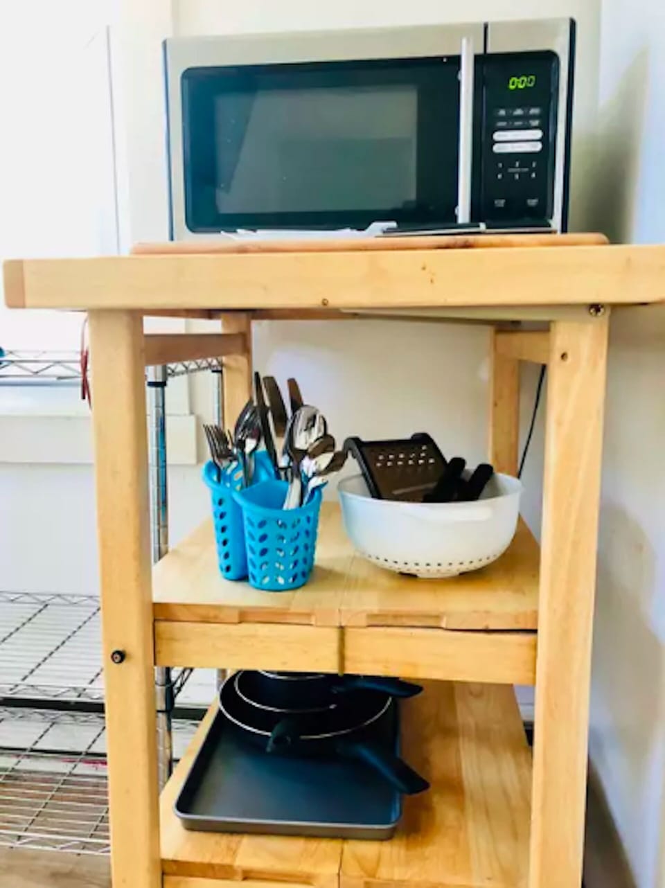 There's a microwave, together with new cooking utensils.