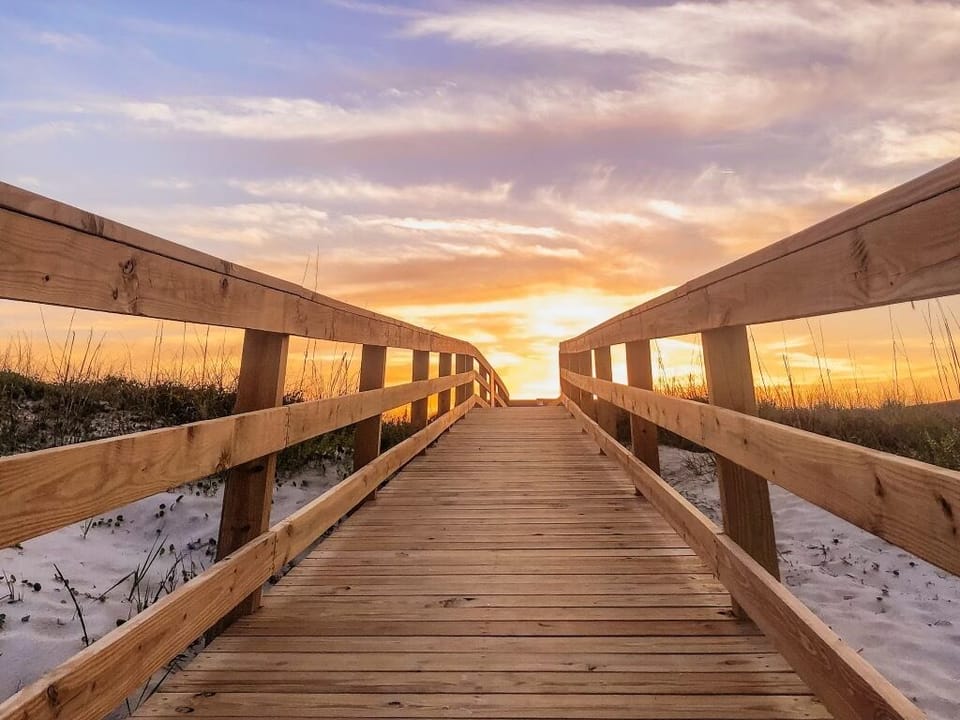 SUNRISE as you come over the dunes on our private boardwalk to the beach