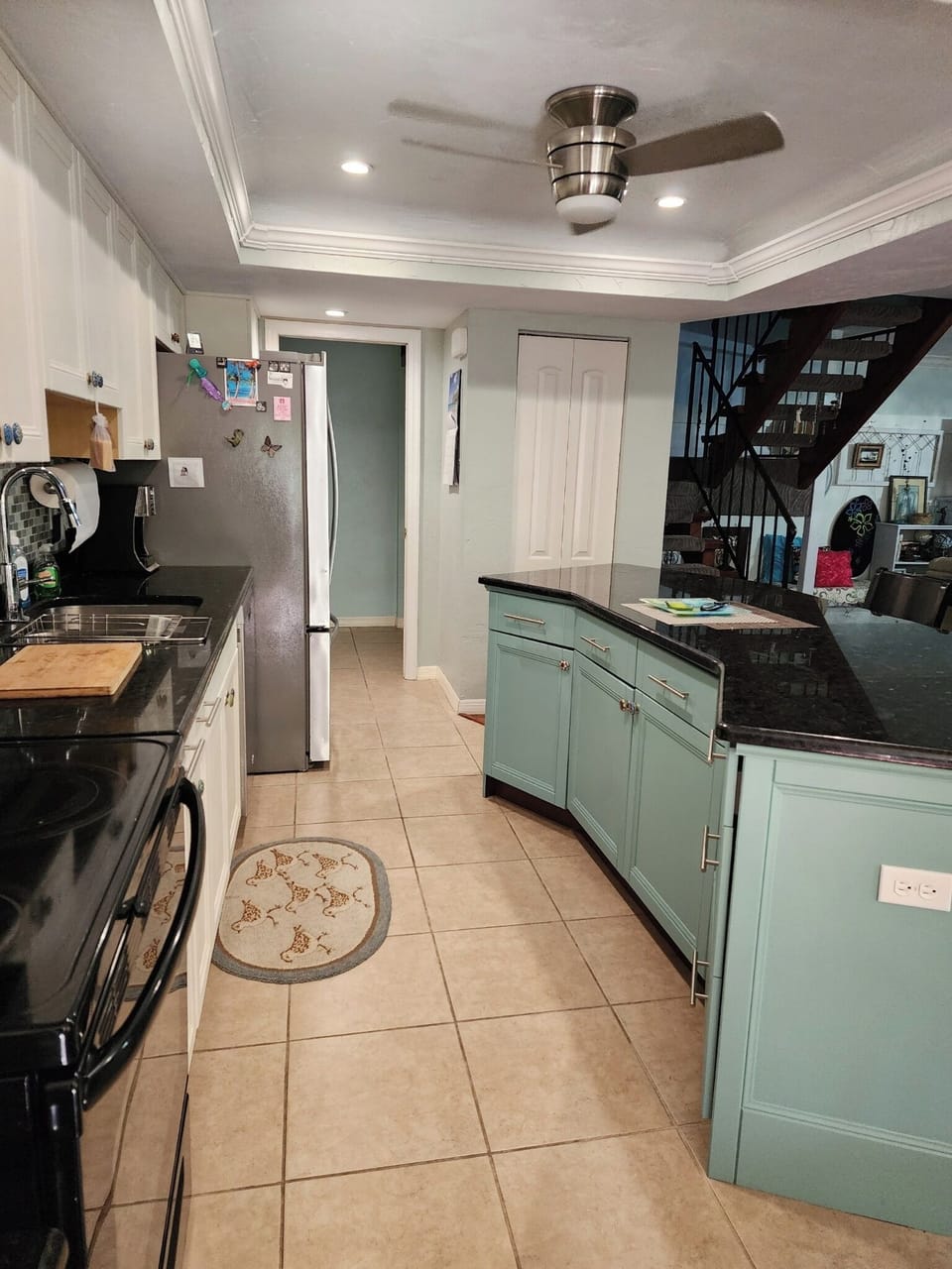 Kitchen.  Open concept to dining and living room spaces.