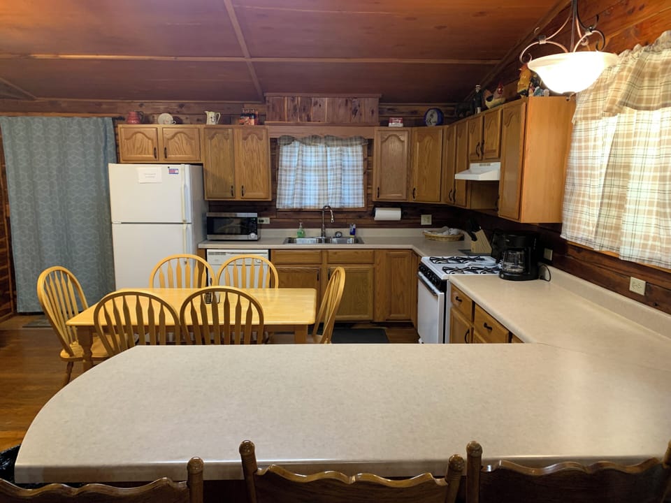 Nice kitchen with fridge, dishwasher, coffeepot, microwave, gas stove, & toaster