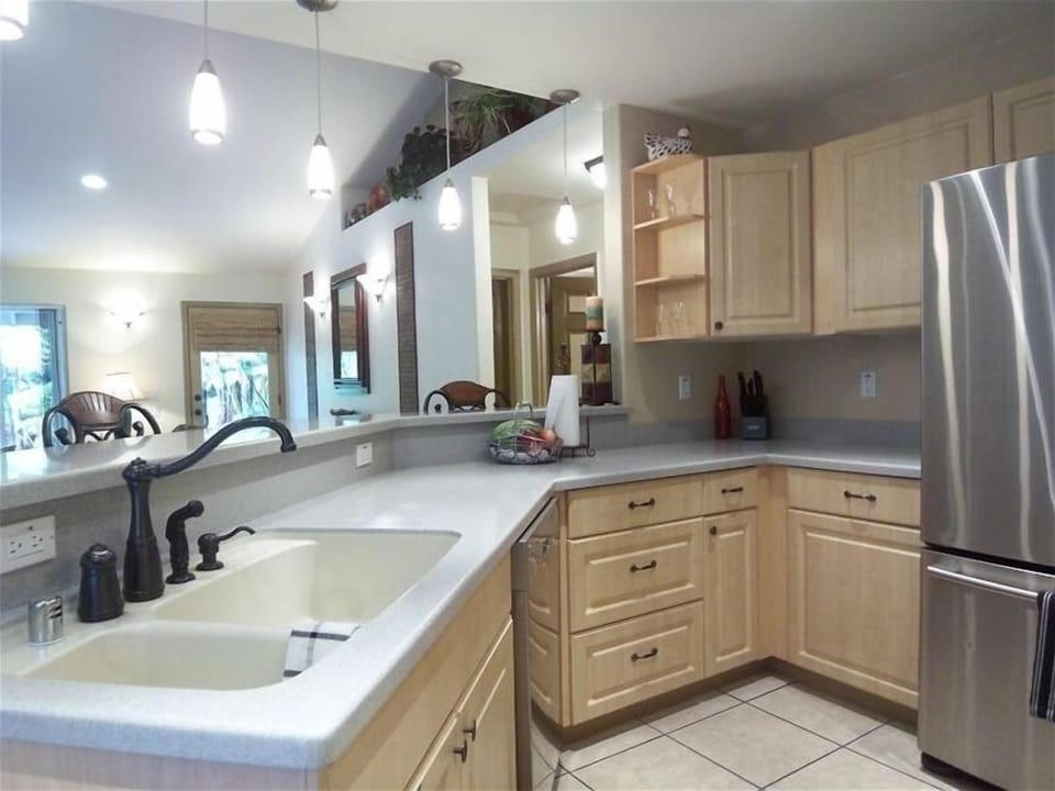 This up-to-date kitchen has a gas range, dishwasher & is well-stocked.