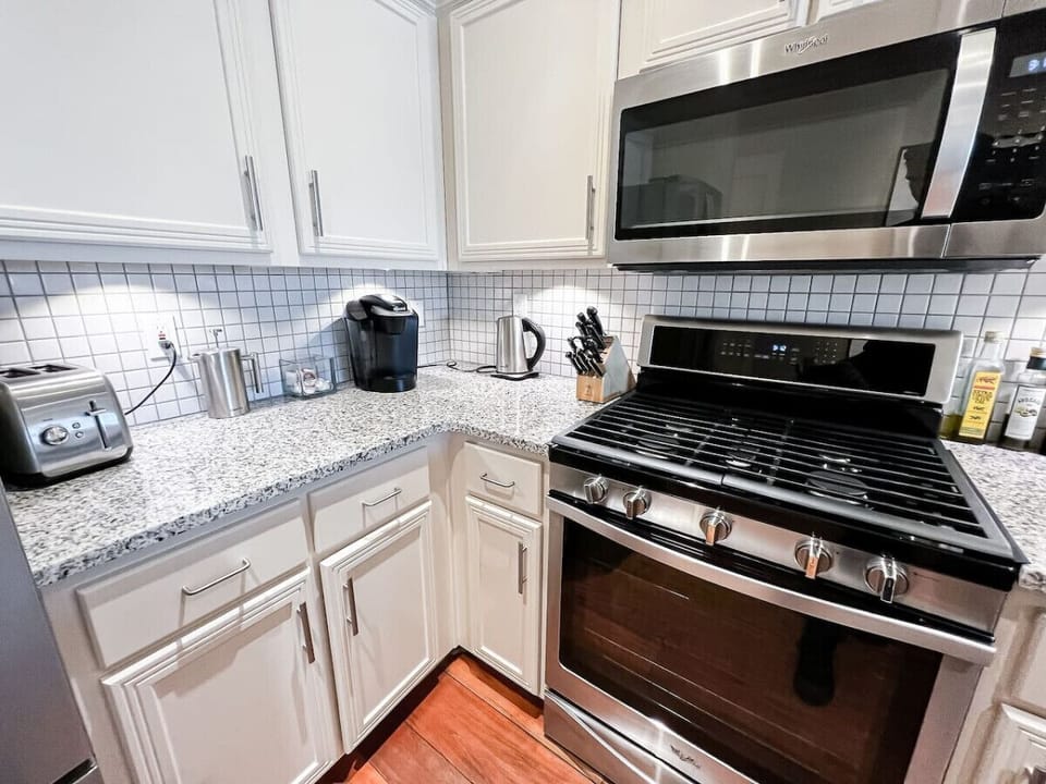 Enjoy the convenience of a fully equipped kitchen with modern appliances, including a gas stove, microwave, and coffee maker. Perfect for brewing your morning coffee or preparing gourmet meals with ease