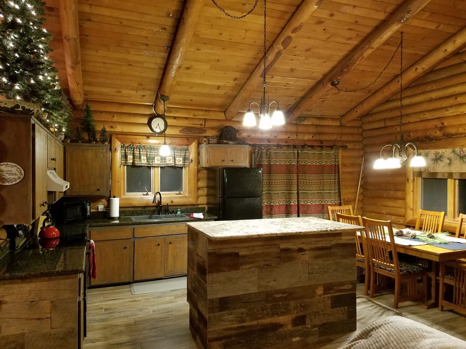 kitchen fully stocked with baking and cooking needs. Dining table seats 6 