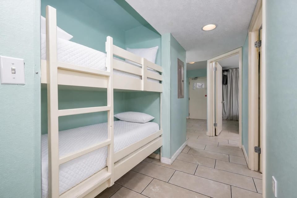 The kids can rest comfortably with bunk beds in the hallway, featuring two sturdy beds and soft linens for a restful sleep