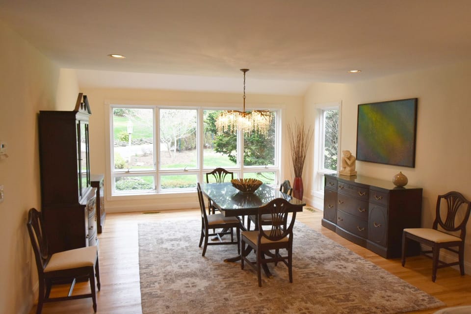 Dining room overlooking front yard , tree lined drive