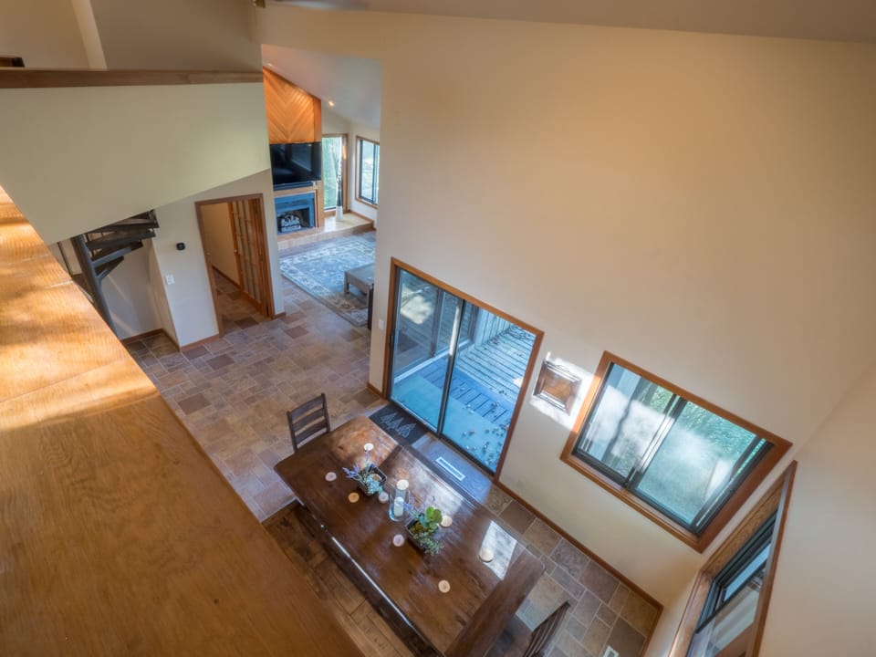 View from the loft into the living room and dining room.