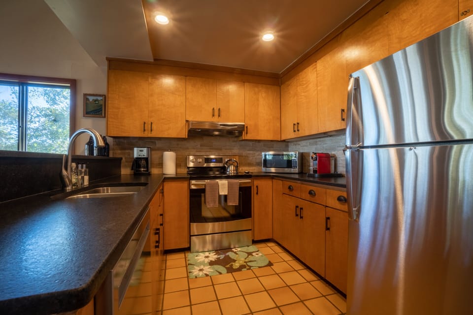 The well-appointed, modern kitchen even includes a Nespresso machine!