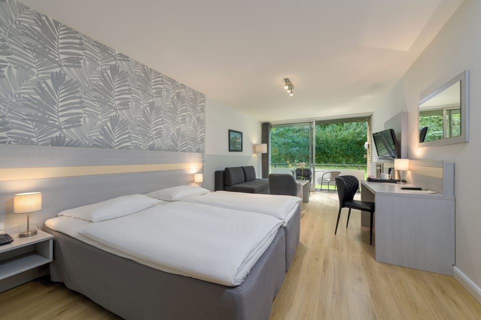 Comfort Room | Pillowtop beds, iron/ironing board, free WiFi, bed sheets