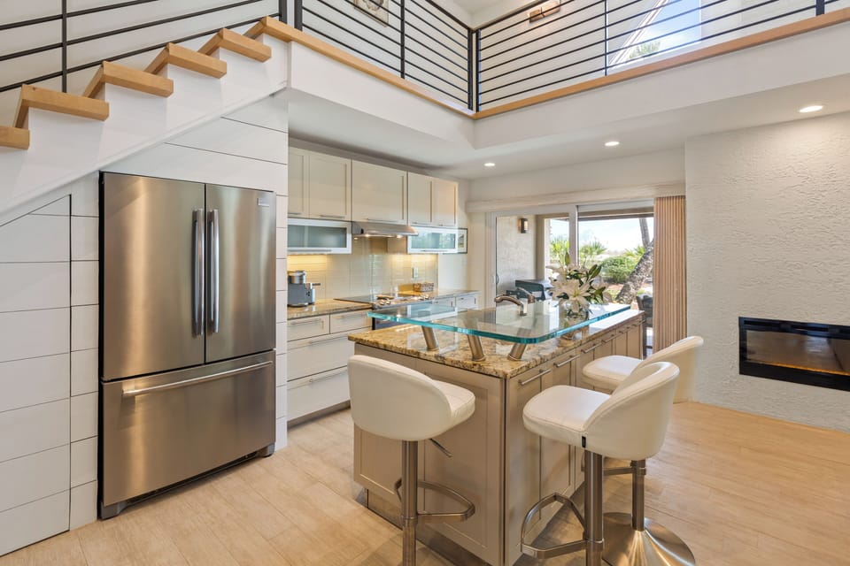 Chef's Kitchen features a raised glass breakfast bar