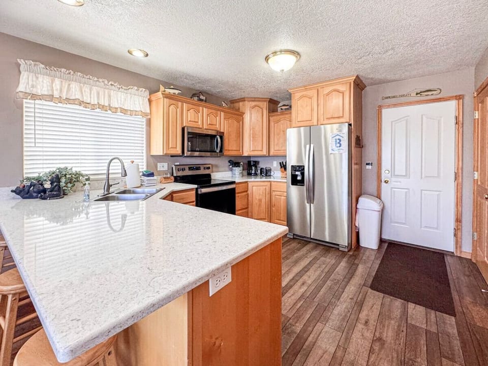 Bright, modern kitchen with spacious counters—perfect for cooking, gathering, and sharing delicious moments