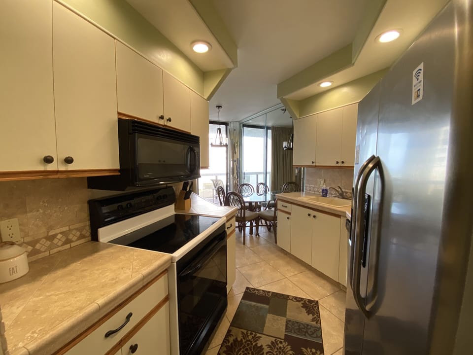 Our fully equipped kitchen is situated by the breakfast area and balcony