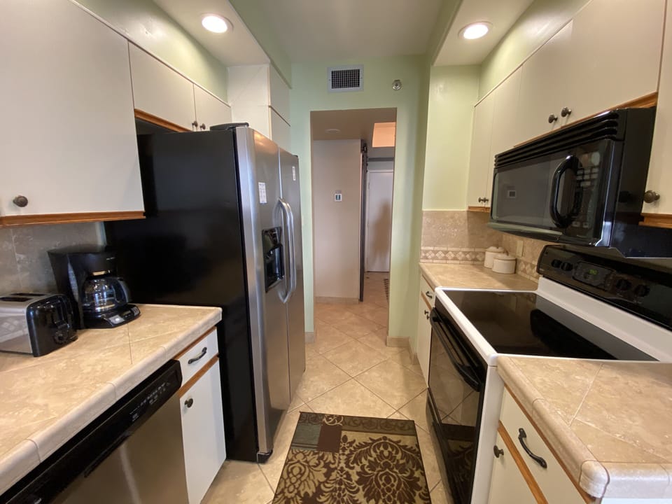 Our fully equipped kitchen is situated by the breakfast area and balcony