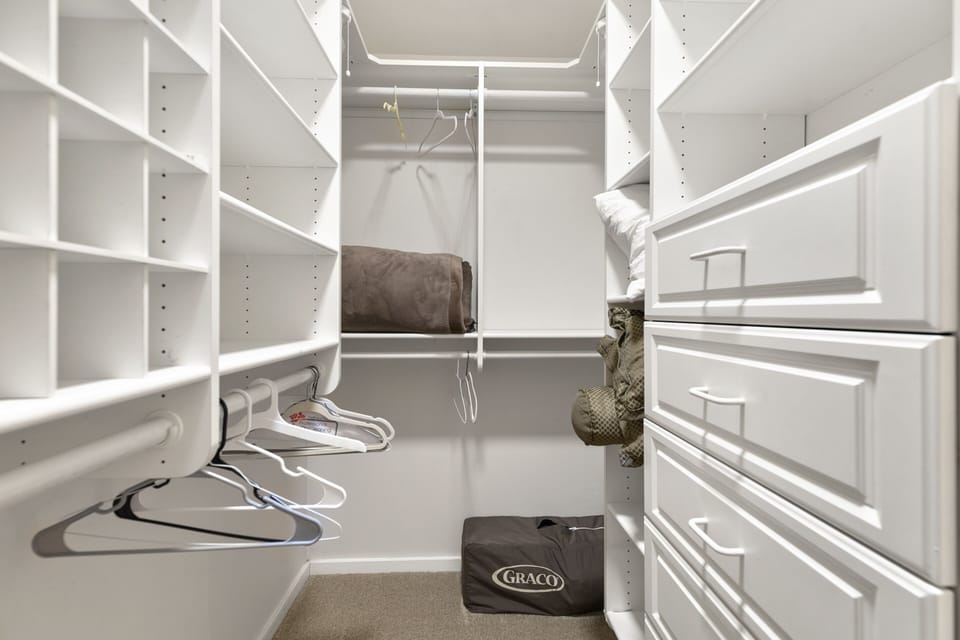 Plenty of space to hang your clothes.  The portable crib is stored here.