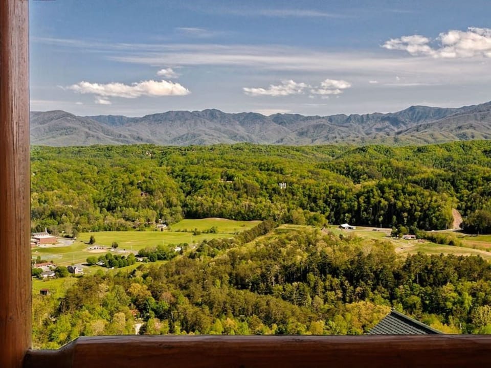 - Expansive mountain view stretching over green valleys and forest tops   - Gaze across rolling hills and the Smoky Mountain horizon in daylight   - Perfect spot for quiet mornings filled with natural beauty and calm