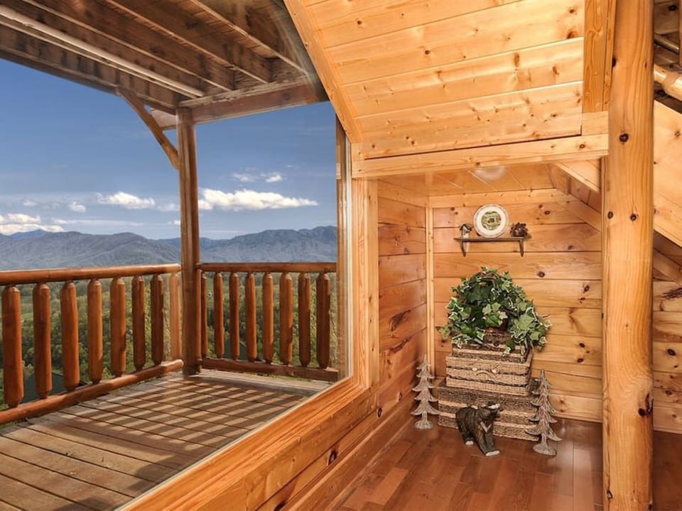 - Upper balcony corner filled with natural light and mountain scenery   - Peaceful nook to unwind with fresh air and endless panoramic views   - A quiet retreat where wood, warmth, and wilderness meet beautifully