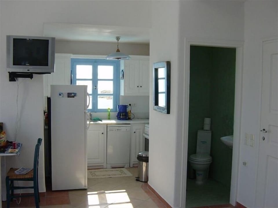 View to kitchen and half bathroom.