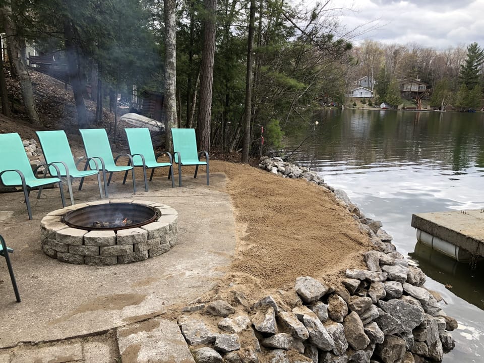 Patio with fire pit on the water