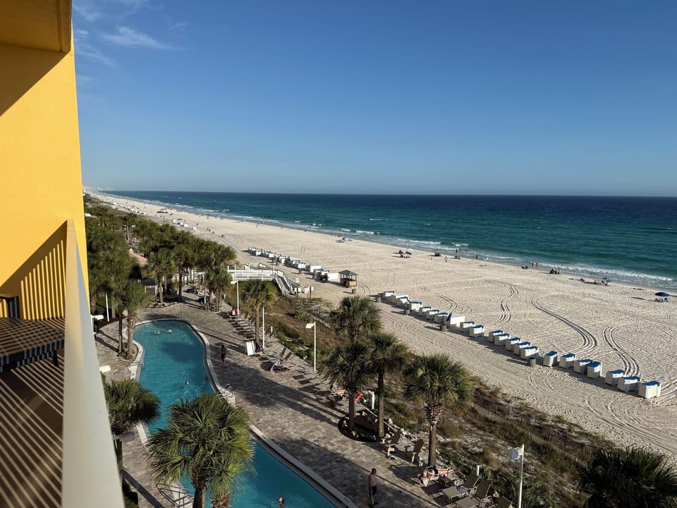 View of beach and lagoon shaped pool