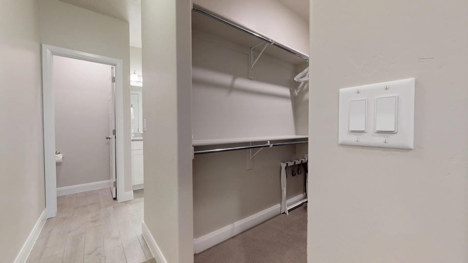 Main level master suite featuring a walk in closet