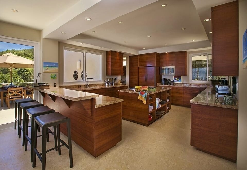 The open, well-ordered kitchen has plenty of space for cooking, or congregating.