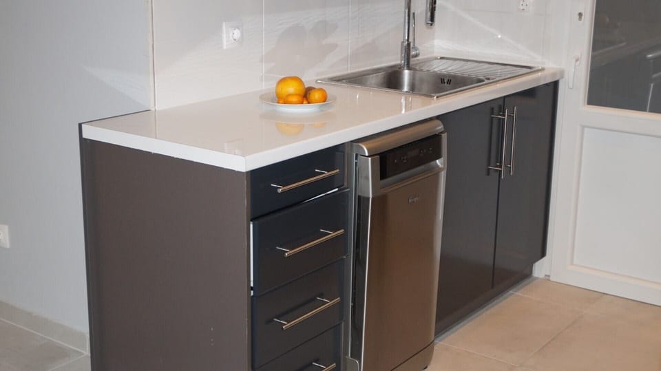 The kitchen includes also a dishwasher.