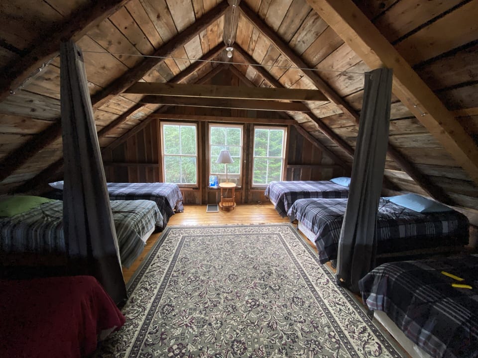 Upstairs loft with 1 double and 7 twin beds. Extra twin bed available!