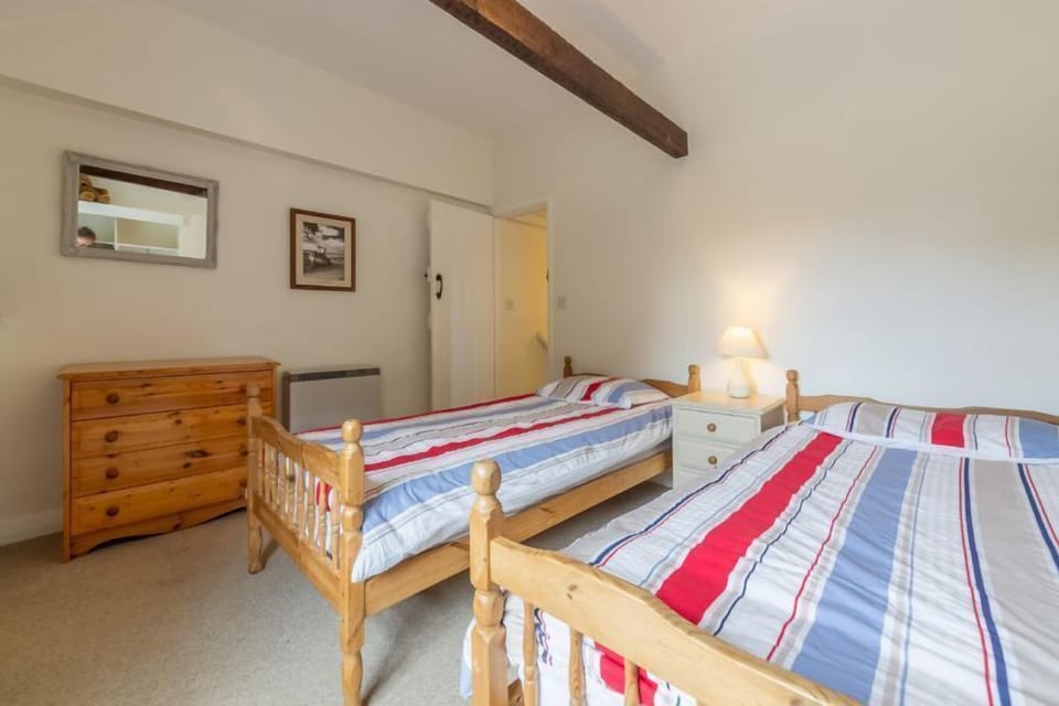 First floor: Bedroom two with full size twin single beds