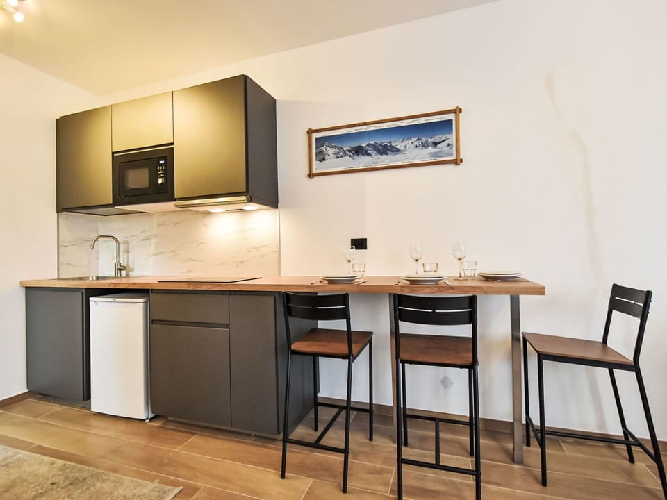 Furniture, Interior Design, Flooring, Wood, Countertop, Floor, Kitchen, Cabinetry, Lighting, Room