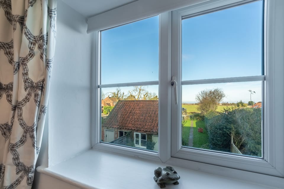 Froggy Cottage, Thornham: Bedroom two boasts views across the marshes