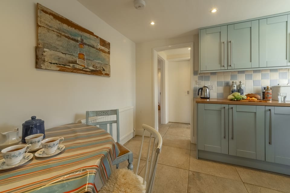 Ground floor: Kitchen leading to the utility area